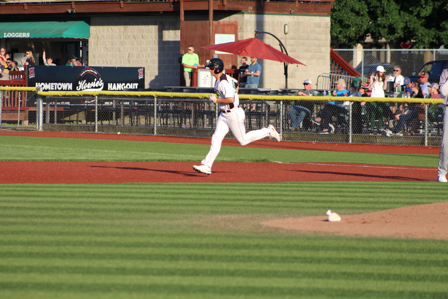 Ronald Sweeny rounds the bases after hitting a home run